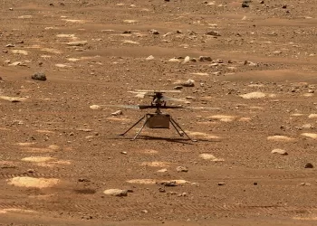 This image captured by the Mastcam-Z imager on NASA's Perseverance Mars rover on April 8, 2021 shows helicopter Ingenuity on Mars