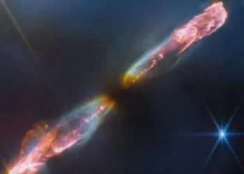 这张渲染图显示了一颗新生恒星在喷出强大气体射流后产生的冲击波，该渲染图是使用 2023 年 9 月 14 日詹姆斯·韦伯太空望远镜的数据创建的。
