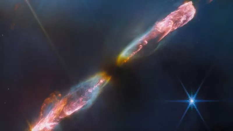 这张渲染图显示了一颗新生恒星在喷出强大气体射流后产生的冲击波,该渲染图是使用 2023 年 9 月 14 日詹姆斯·韦伯太空望远镜的数据创建的。