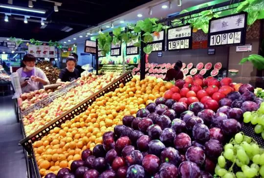Shoppers buy fruit at a supermarket in Shijiazhuang, Hebei province.
