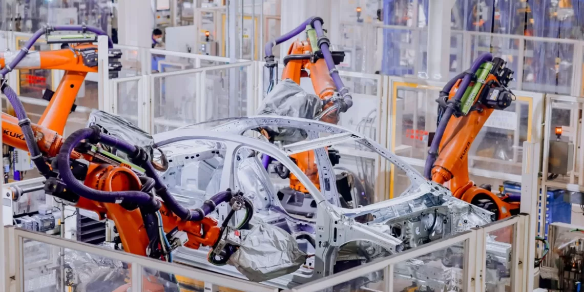 Robot arms make automobiles in a factory in Qingdao, East China's Shandong province on Dec 20, 2022.
