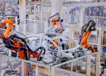 Robot arms make automobiles in a factory in Qingdao, East China's Shandong province on Dec 20, 2022.